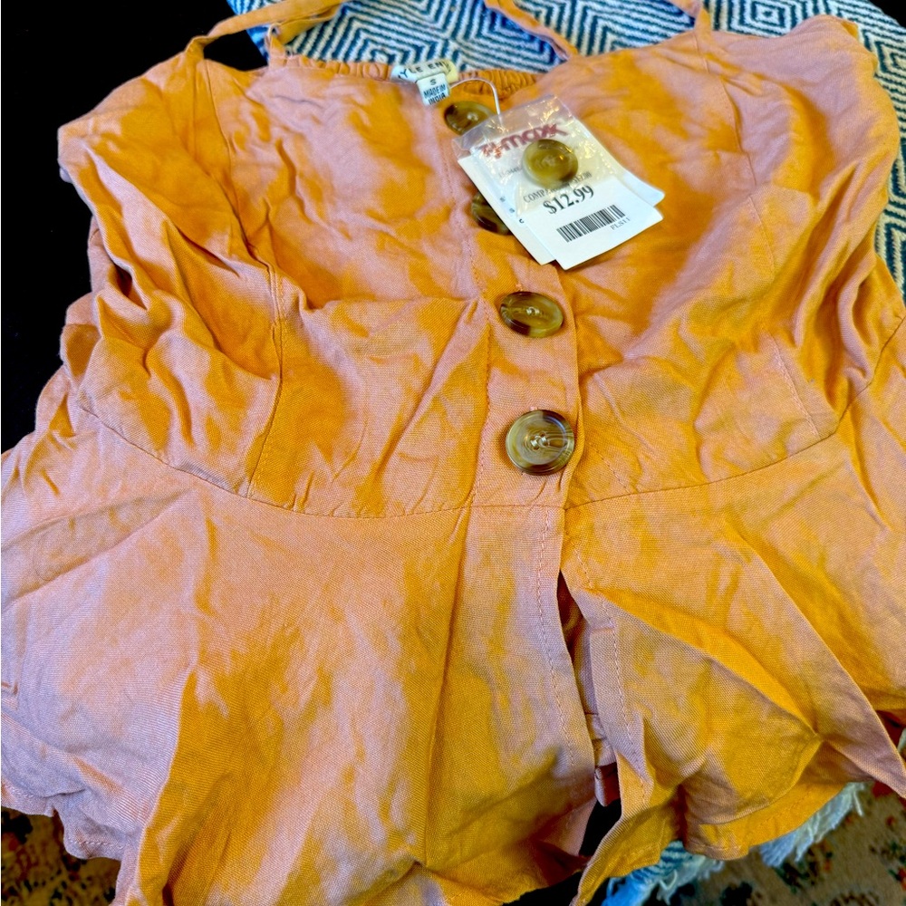Orange Button-Front Sleeveless Top
Is more like a peach color brand mew.